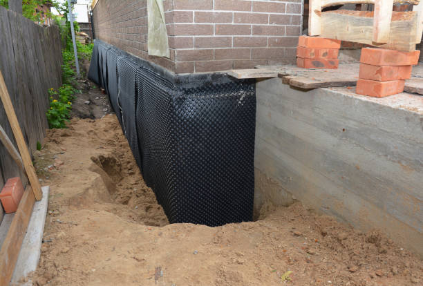 SJ Waterproofing Pros technician performing targeted Exterior Waterproofing assessment in Elmore, AL